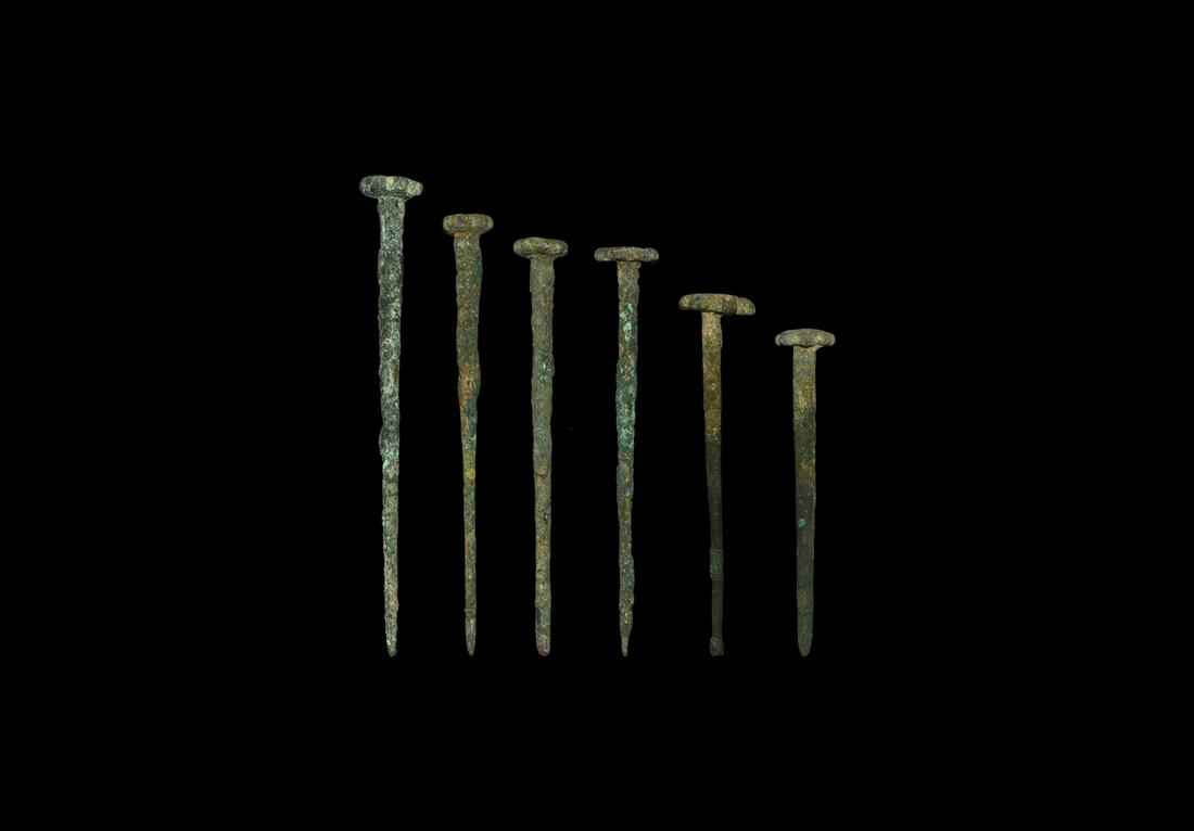Western Asiatic Seal-Topped Pin Group: Late 3rd millennium BC. A mixed group of bronze dress pins, each with tapering shank and rosette finial, including two accompanied by typed and signed notes by the late W.G. Lambert, Professor of Assy