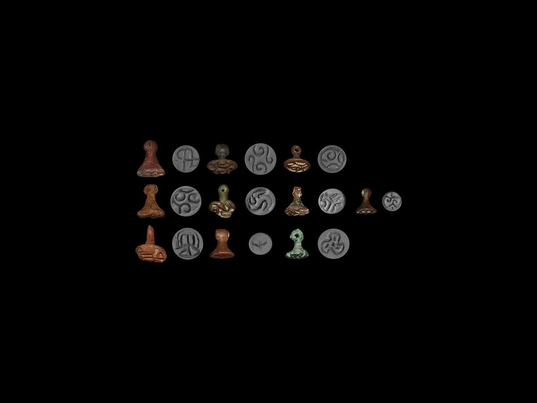 Western Asiatic Stamp Seal Collection: Late 3rd-2nd millennium BC. A mixed group of ten bronze seals with various shapes and designs including nine accompanied by typed and signed notes by the late W.G. Lambert, Professor of Assyriology at