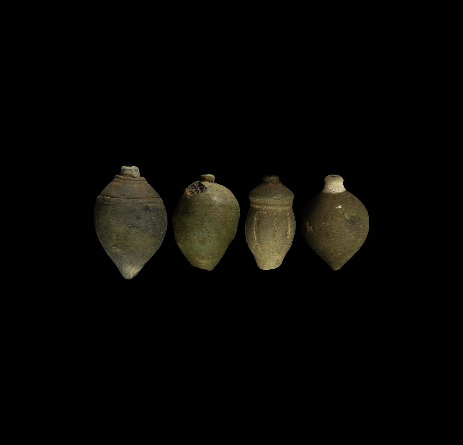 Byzantine 'Greek Fire' Fire Bomb or Hand Grenade Group: 9th-11th century AD. A group of four hollow ceramic vessels each with conical body, intended to be filled with explosive liquid and a wick, and used as a hand grenade; one an irregular bulb with roule