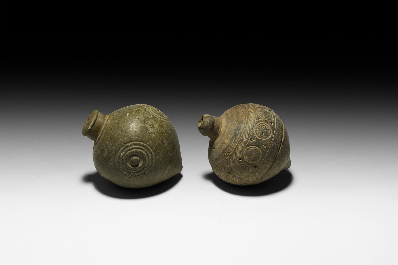 Byzantine 'Greek Fire' Fire Bomb or Hand Grenade Group: 9th-11th century AD. A pair of hollow ceramic vessels each with conical body, intended to be filled with explosive liquid and a wick, and used as a hand grenade; one with short neck and flat nozzle, f