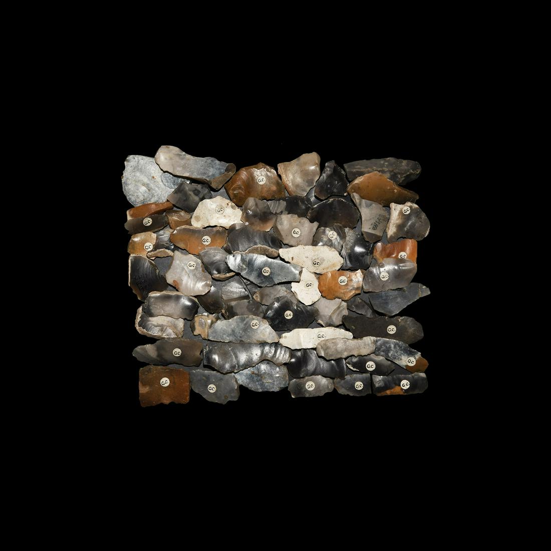 Stone Age Historic British Blade, Retouched Flint: Mainly Mesolithic, 12,000-5,000 BC. A mixed group of knapped flint scrapers and other tools, some retouched, some marked with collector's label 'G.C.' 246 grams total, 24-55mm (1 - 2"). Property of an