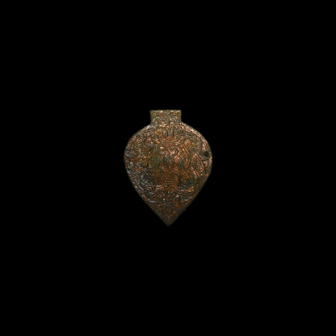 Viking Gilt Horse Harness Mount: 9th-11th century AD. A bronze leaf-shaped harness mount with two opposing entwined beasts; attachment lugs to the reverse. 16.8 grams, 59mm (2 1/4"). Property of a professional collector; acquired bef