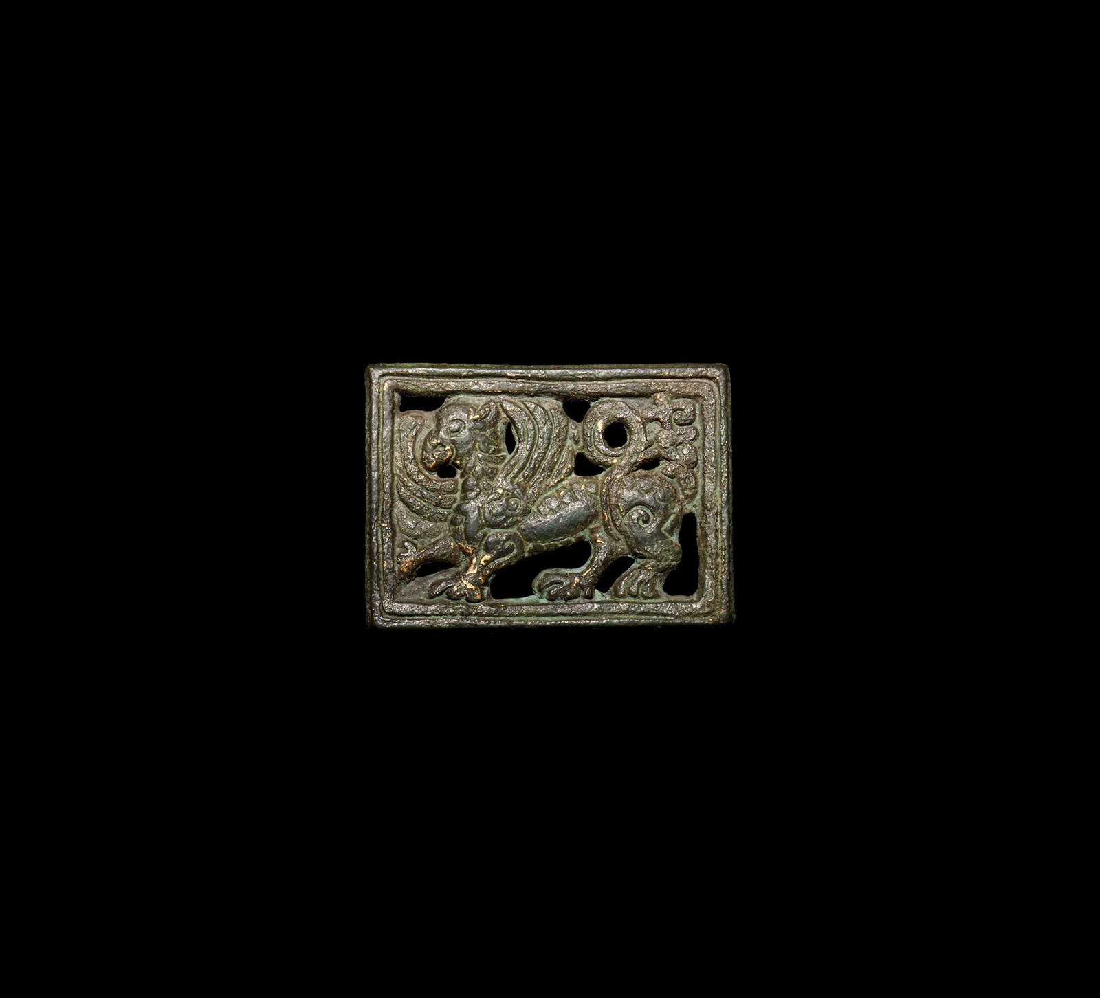 Medieval Gilt Griffin Belt Mount: 13th-15th century AD. A rectangular openwork gilt bronze mount with an advancing griffin; attachment lugs to the reverse. 16.9 grams, 40mm (1 1/2"). From a London W1, UK, collection; acquired on the G