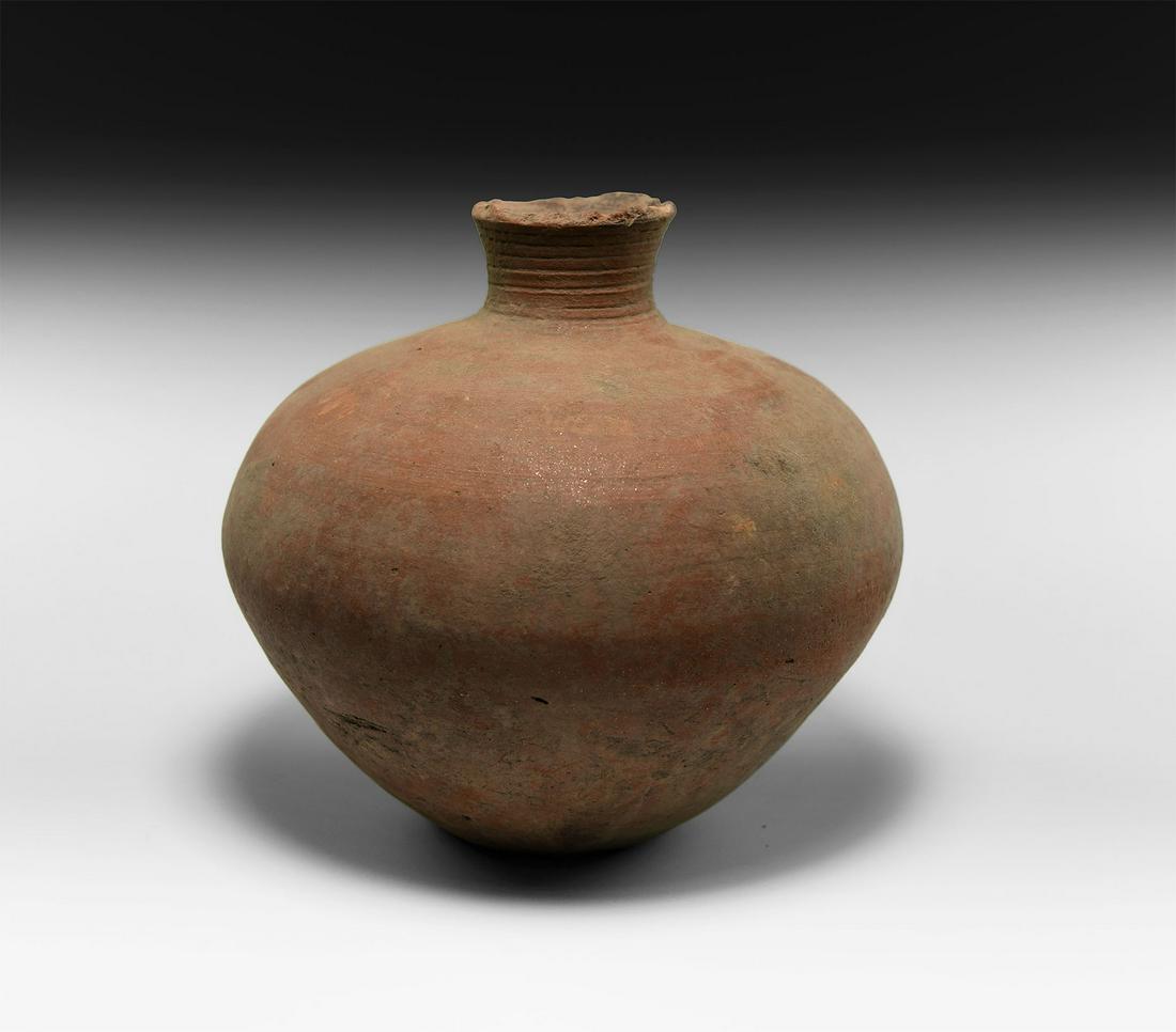 Roman Redware Wine Vessel: 1st-2nd century AD. A globular redware ceramic wine jar with ribbing to the flared mouth. 1 kg, 18cm (7"). Private collection, Cambridgeshire, UK; acquired prior to 2000. [No Reserve]