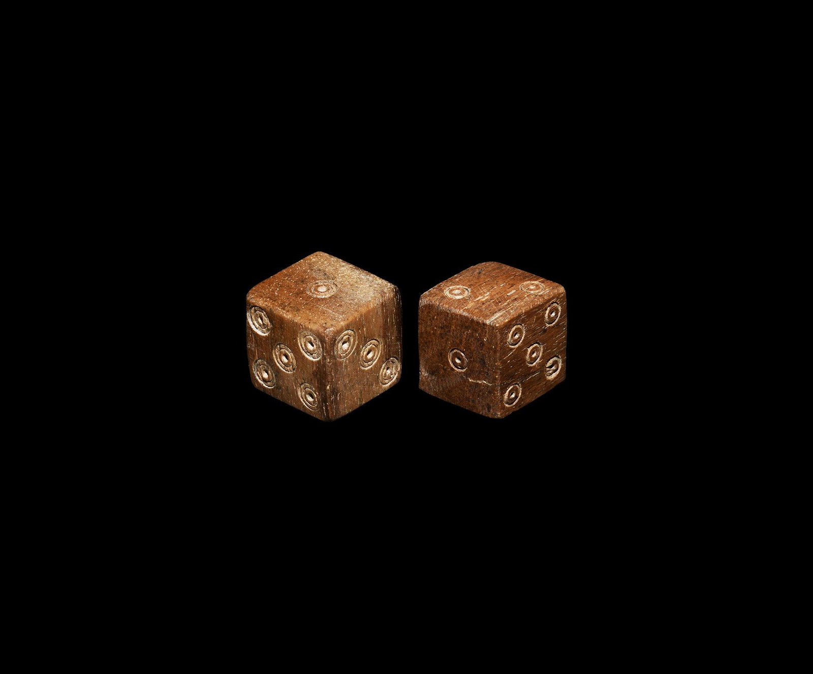 Roman Bone Dice Pair: 1st-3rd century AD. A pair of cuboid bone dice with ring-and-dot markings arranged 1:6, 2:3, 4:5. 11.5 grams total, 14-15mm (1/2"). From an important English collection; acquired in the 1990s. [2, No 
