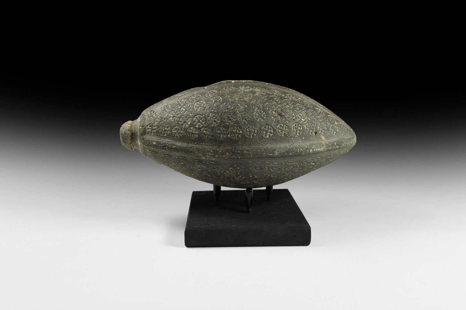 Byzantine 'Greek Fire' Hand Grenade or Fire Bomb: 9th-11th century AD. A hollow ceramic vessel with biconical profile intended to be filled with explosive liquid and wick, used as a hand grenade; four vertical external ribs enclosing textured panels,