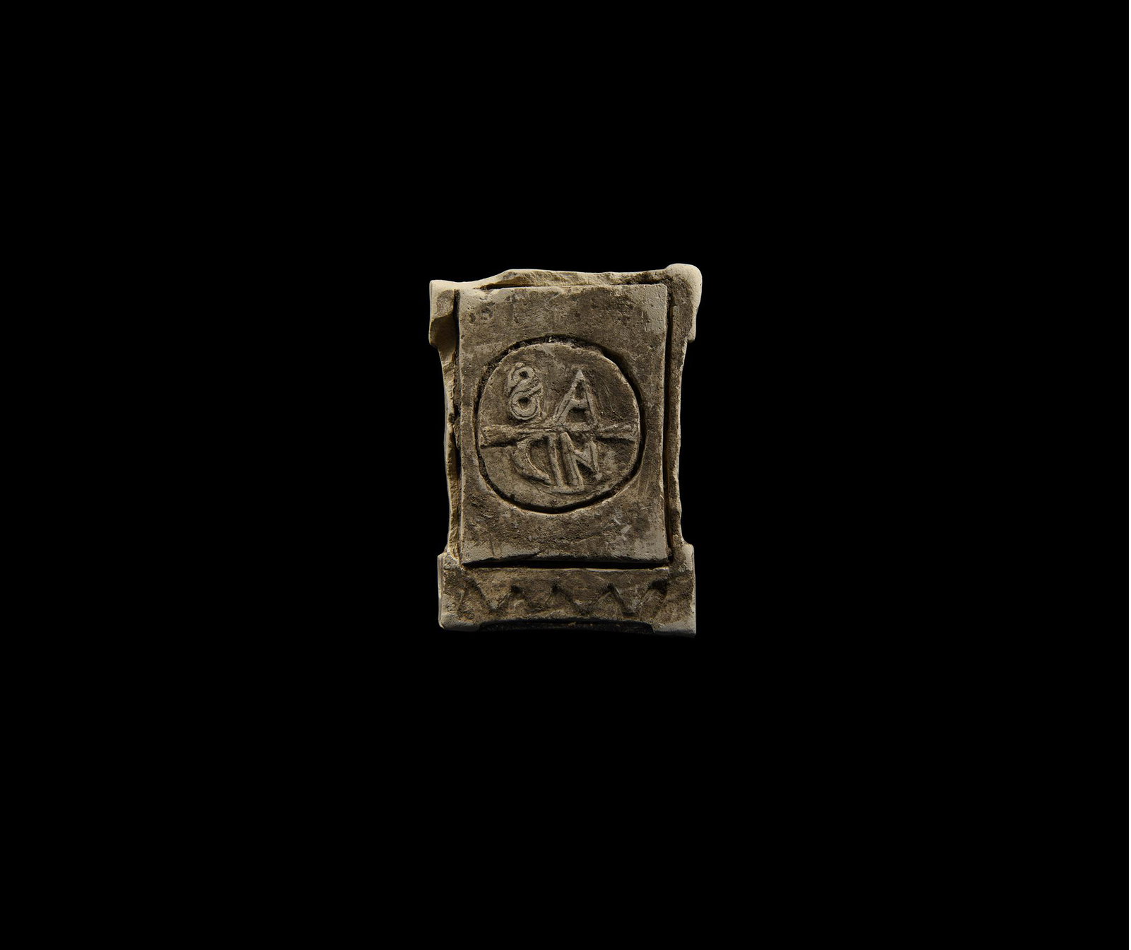 Byzantine Stamp Seal: 6th-9th century AD. A large rectangular composition stamp seal with columnar handle, the underside with a raised monogram in reverse 'AS/ND' within an incised circular border. 94 grams, 82mm (3 1/4").