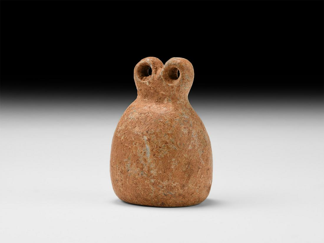 Eye Idol: 3rd-2nd millennium BC. A carved limestone amulet with bulbous body and two annular eyes above. 57.7 grams, 47mm (1 3/4"). Property of a Bristol collector; formerly part of his father's collection form