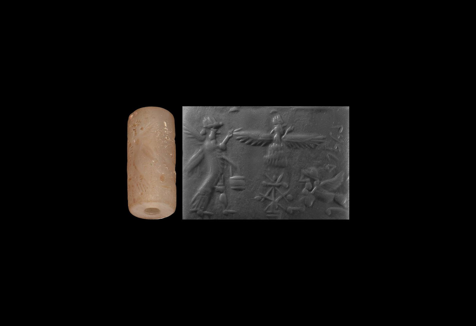 Cylinder Seal with Figures: 2nd millennium BC. An chalcedony cylinder seal with intaglio frieze depicting a robed female figure with wings holding a vessel in her extended hand towards a winged being (faravahar?) above a fire(?)