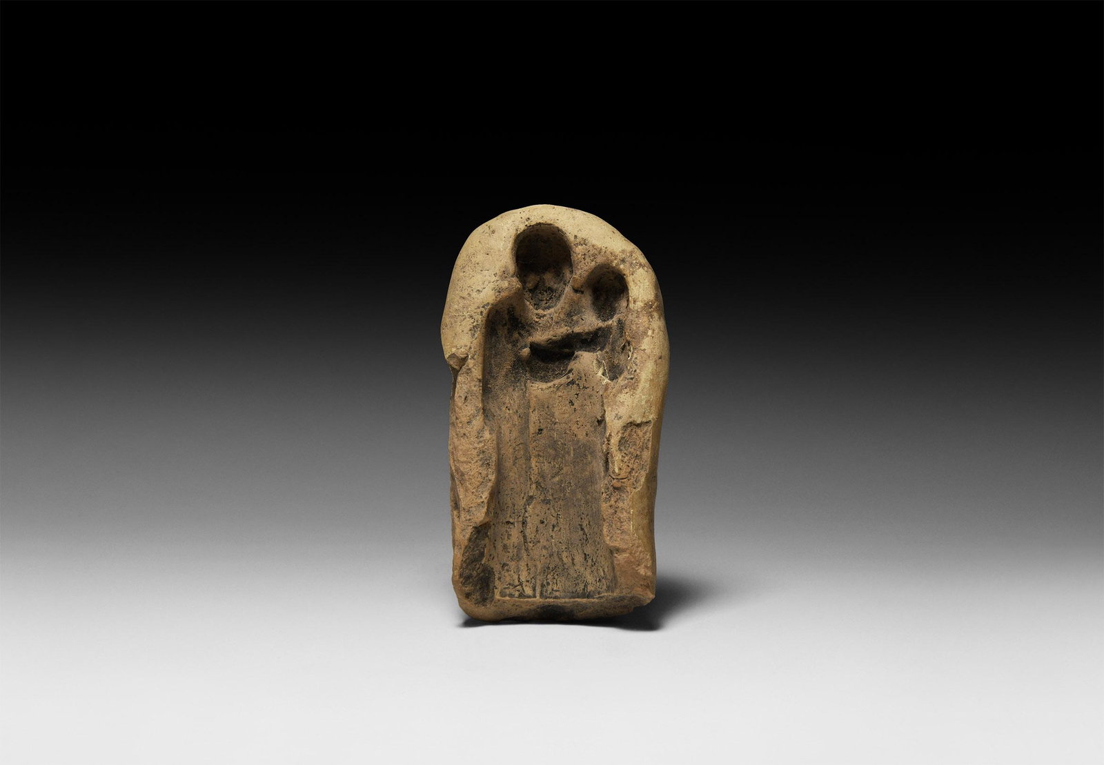 Old Babylonian Terracotta Figure Mould: 20th-16th century BC. A terracotta mould for a standing figure; accompanied by a handwritten and signed scholarly note by W.G. Lambert, late Professor of Assyriology at the University of Birmingham 19