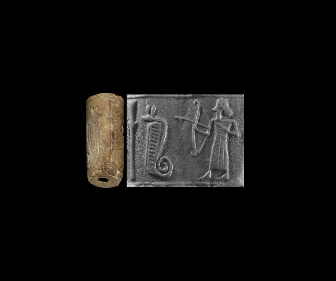Cylinder Seal with Archer and Cobra: 1st millennium BC. A jasper cylinder seal with intaglio frieze of an archer in fringed robe releasing an arrow towards a rearing cobra with coiled tail; accompanied by a museum-quality impression. 3.7