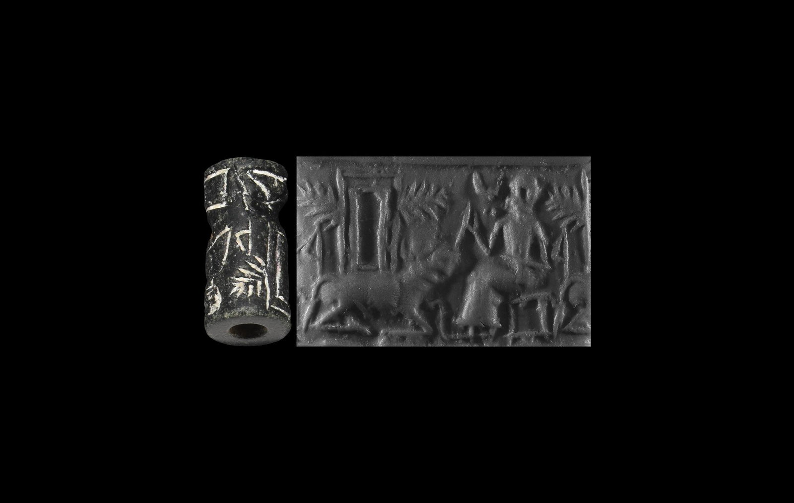 Cylinder Seal with Court Scene: 2nd millennium BC. A black limestone cylinder seal with intaglio frieze depicting a bull kneeling beneath a rectangular frame with lateral fronds, robed figure seated holding a leash on the bull benea