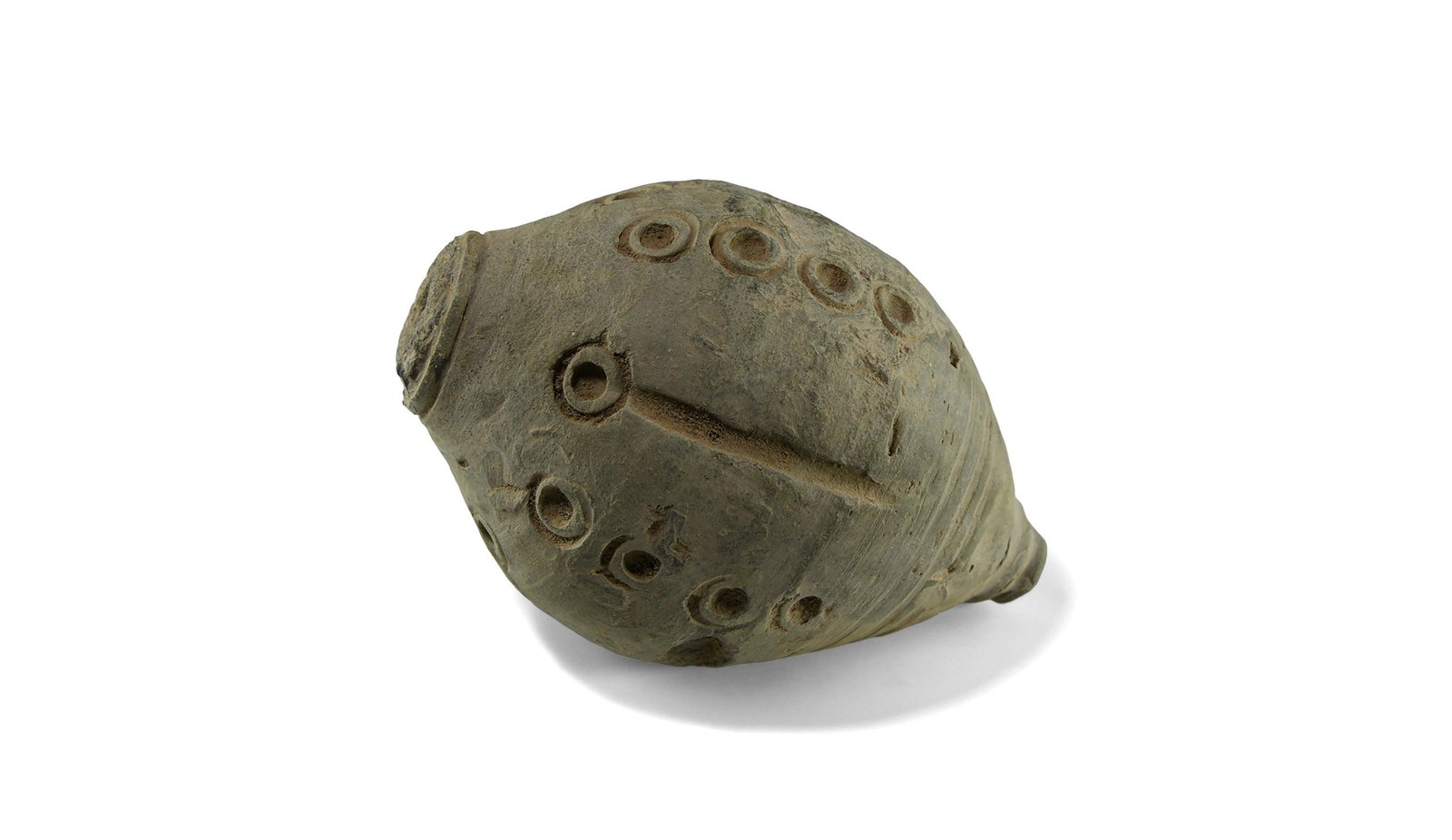 Byzantine 'Greek Fire' Hand Grenade or Fire Bomb: 9th-11th century AD. A hollow ceramic vessel with domed top and conical base intended to be filled with explosive liquid and a wick, and used as a hand grenade; the body divided into panels with verti