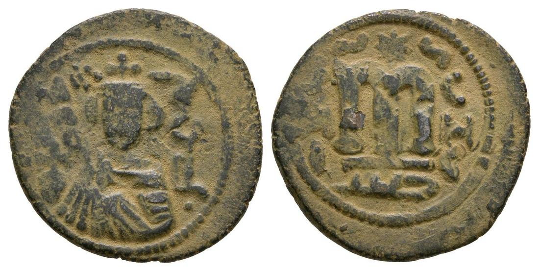 Arab-Byzantine - Facing Bust Fals: 7th-9th century AD. Hims/Homs mint. Obv: facing bust with inscription. Rev: large M with E / M / I left and C / H / C right; mintmark in exergue. See Wilkes 1, 133; cf. Foss, nos. 64-77. 3.78 grams. (