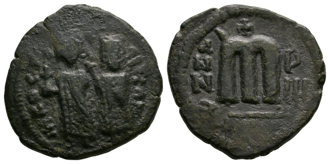 Persian Occupation of Syria - Standing Figures Bronze: 610-630 AD. Phocas and Leontia type. Obv: emperor and empress standing facing. Rev: large M with cross above; ANNO to left, ?IIIo (year 9) to right, uncertain letters in exergue. Cf. Pottier 11a.2, 13