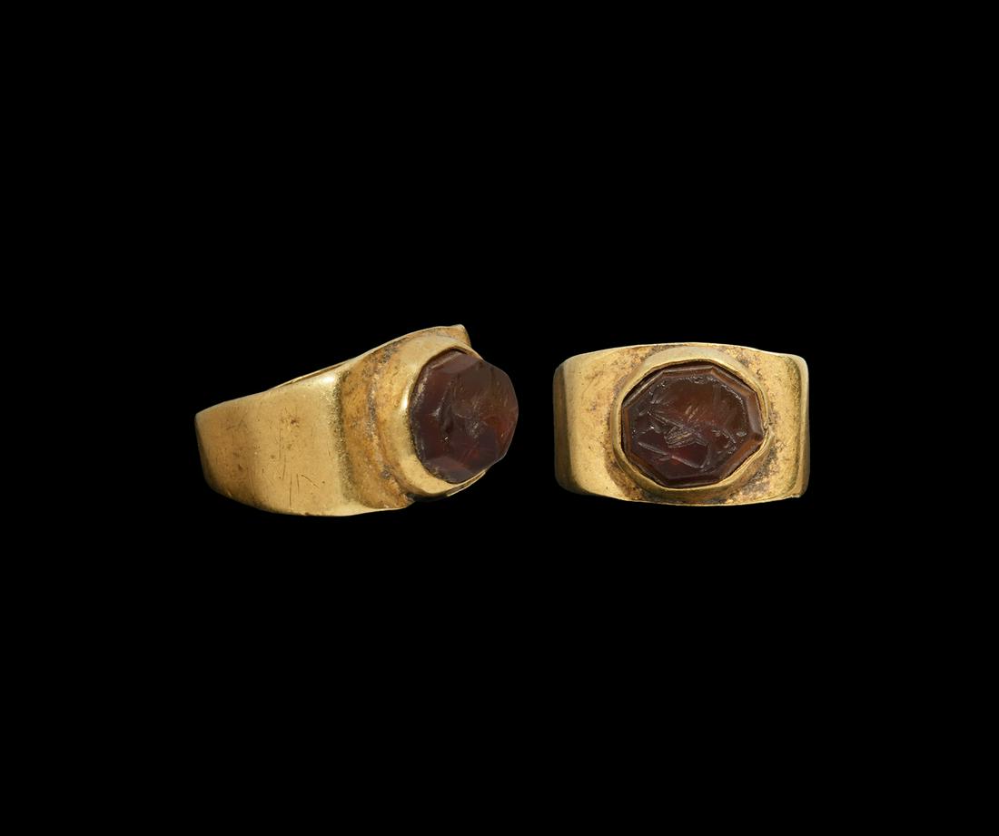 Roman Gold Ring with Cockerel Gemstone: 3rd-4th century AD. A small gold finger ring with rectangular plaque, cell with inset octagonal carnelian gemstone, intaglio cockerel motif. 4.75 grams, 20mm overall, 15.42mm internal diameter (approx