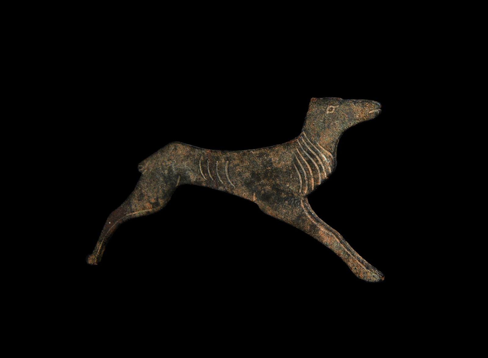 Tudor Bifacial Stag Applique: 16th century AD. A large bronze bifacial applique of a leaping stag, incised body and facial detailing, long mane, antlers absent. 44 grams, 13cm (5"). From a private Netherlands collection; previousl