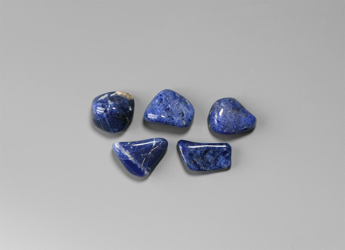 Polished Blue Sodalite Specimen Group: A group of five polished royal blue sodalite specimens. 34.4 grams total, 22-27mm (1"). Property of a West Sussex gentleman; acquired on the UK natural history market. [5, No Reserve]