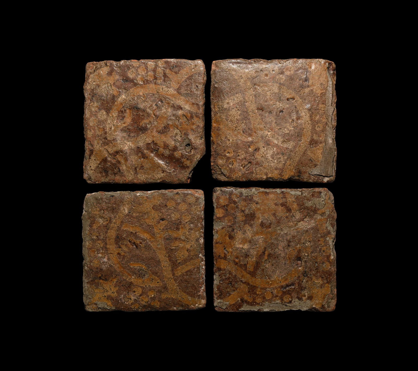 Medieval Elaborate Floor Tile Set: 14th-15th century AD. A group of four square glazed ceramic floor tiles with grapevine pattern. 2.6 kg total, 11 x 11cm each (4 1/4 x 4 1/4"). Ex central London gallery; acquired on the UK art market.