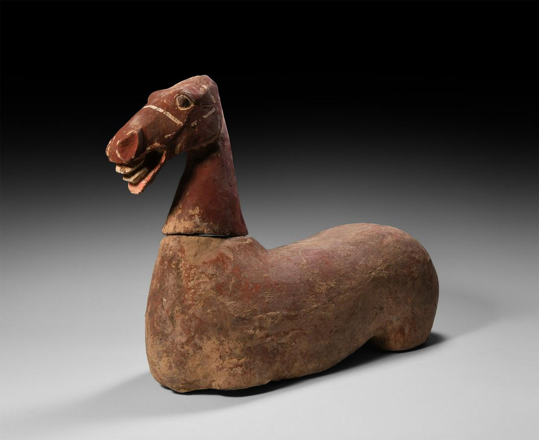 Han Horse Torso and Head: Han Dynasty, 206 BC-220 AD. A ceramic figure comprising the upper body and head of a horse, the head held erect, flared nostrils facing forwards, open mouth to accept a bridle-bit, painted detailing i