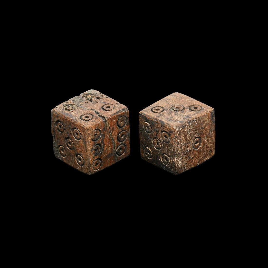 Roman Bone Dice Pair: 2nd-4th century AD. A pair of cuboid dice with ring-and dot markings, configured in formation 1:6, 2:5, 3:4 and 1:6, 2:5, 3:4. 6.7 grams total, 12mm each (01-Feb"). Property of an English collector; a