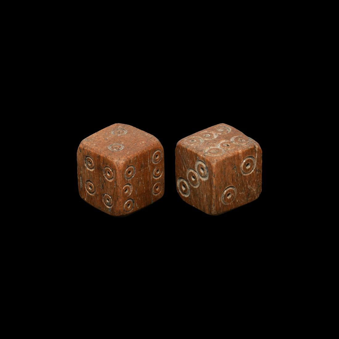 Roman Bone Dice Pair: 2nd-4th century AD. A pair of cuboid dice with ring-and-dot markings in the formation 1:6, 2:5, 3:4. 6.2 grams total, 11-12mm (01-Feb"). Property of an East Sussex, UK, teacher; from the London art ma