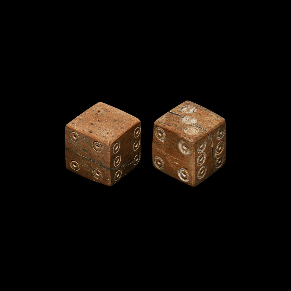 Roman Large Bone Dice Pair: 2nd-4th century AD. A pair of cuboid dice with ring-and dot markings configured in formation 6:1, 5:4, 3:2. 12.1 grams total, 15mm each (01-Feb"). Property of an English collector; acquired in the Net