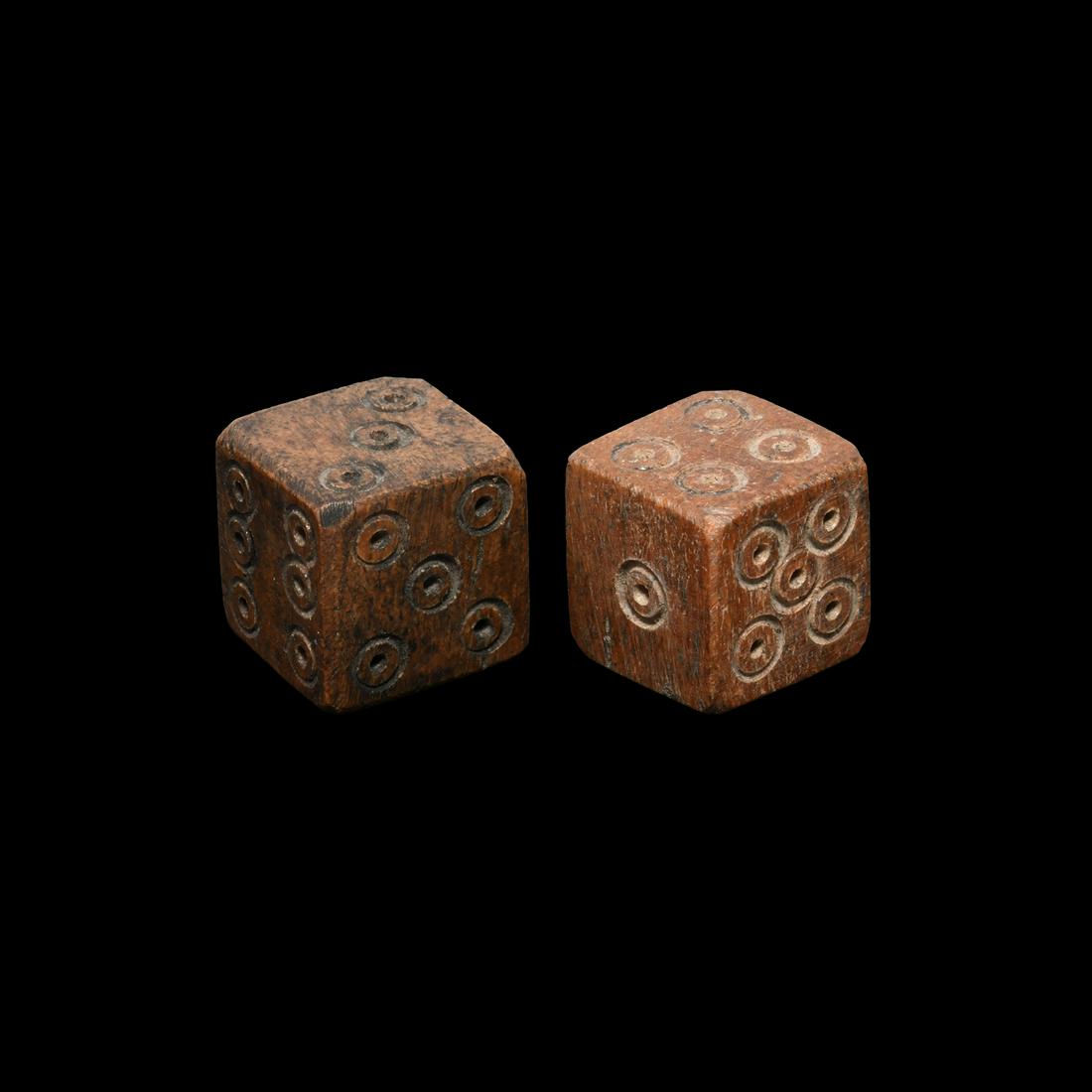 Roman Bone Dice Pair: 2nd-4th century AD. A pair of cuboid dice with ring-and-dot markings in the formation 1:6, 2:5, 3:4. 6.5 grams total, 11-12mm (01-Feb"). Property of an East Sussex, UK, teacher; from the London art ma