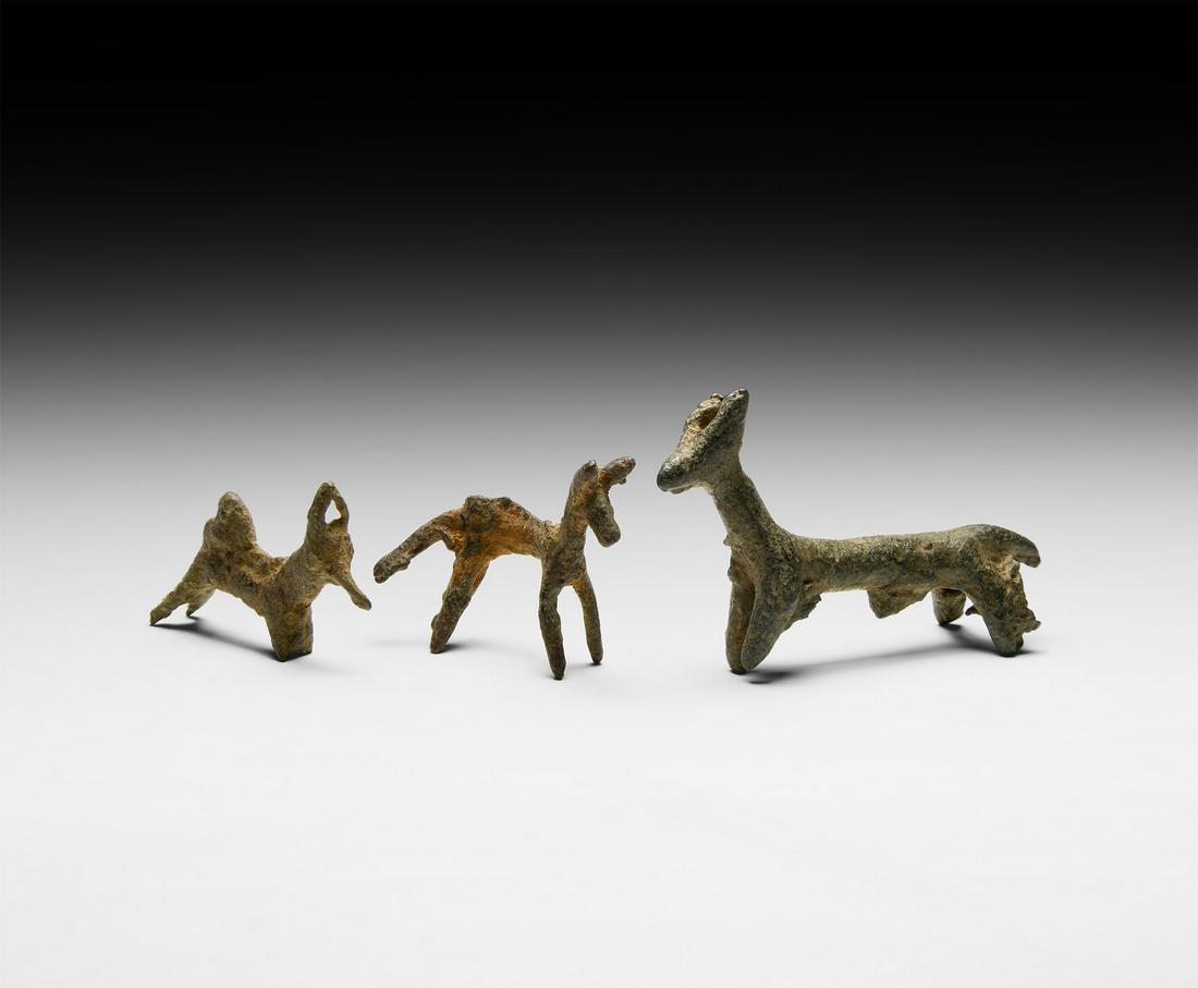 Animal Statuette Group: 2nd-1st millennium BC. A mixed group of slender-bodied bronze animals- goats, deer or other quadrupeds- modelled standing. 36.1 grams total, 32-58mm (1 1/4 - 2 1/4"). Property of a London gentleman; a