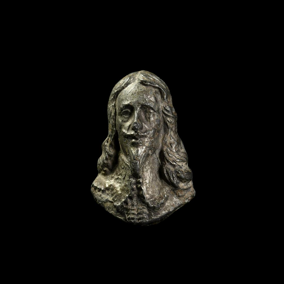 Charles I Bust Applique or Trade Weight: 17th century AD. A high-relief appliqué bust of Charles I with shoulder-length hair, Vandyke beard and large lace collar. 43.3 grams, 41mm (1 1/2"). Property of a Newcastle University Professor; foun
