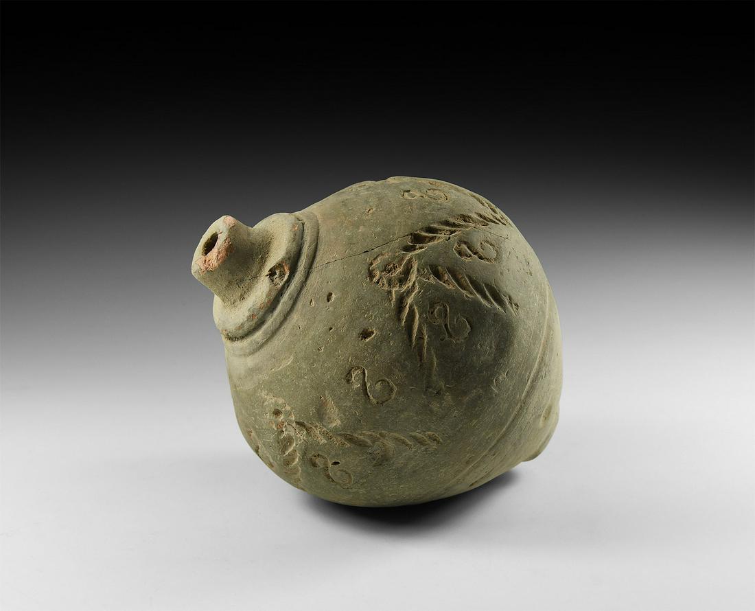 Byzantine 'Greek Fire' Fire Bomb or Hand Grenade: 9th-11th century AD. A piriform ceramic vessel with collared shoulder and short cylindrical neck, decorated with a circumferential band of stamped geometric motifs; intended to be filled with explosiv