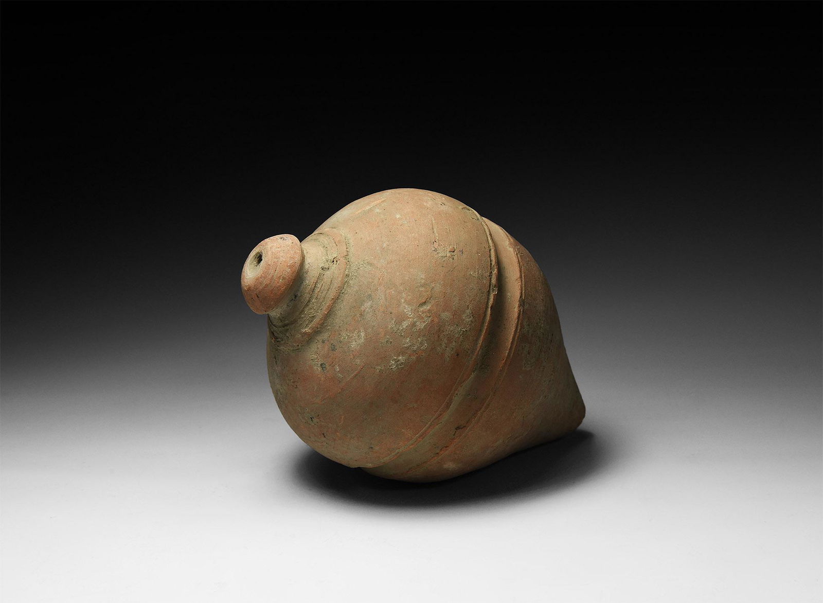 Byzantine 'Greek Fire' Fire Bomb or Hand Grenade: 9th-11th century AD. A piriform ceramic vessel with short neck, domed lip and conical base, medial c-section groove; intended to be filled with explosive liquid and a wick, and used as a hand grenade.
