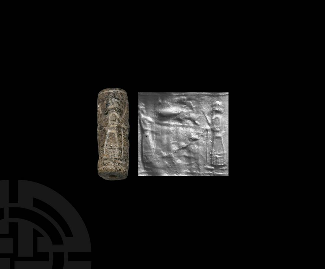 Cylinder Seal with Figures and Offering Table: 10th-8th century BC. A brown jasper cylinder seal, drilled vertically for suspension; accompanied by a museum-quality impression and a typed and signed scholarly note issued by the late W.G. Lambert,