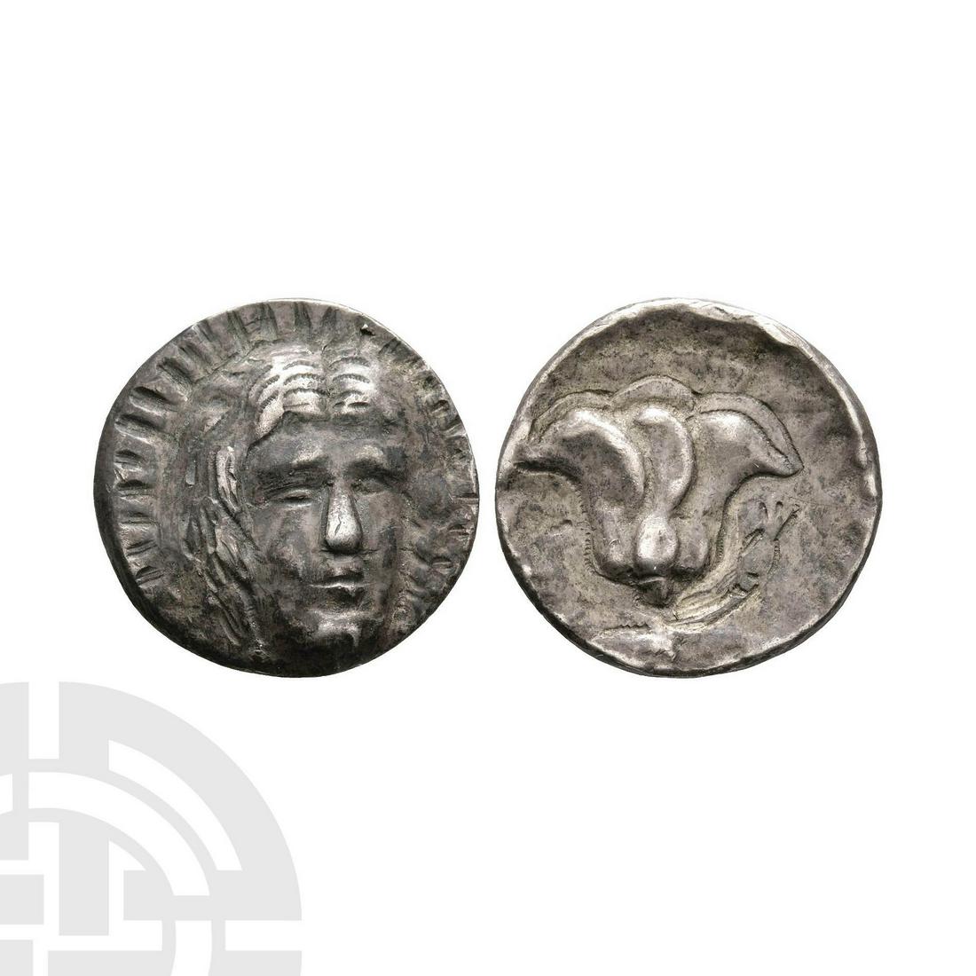 Caria - Rhodes - Rose Drachm: 304-166 BC. Obv: head of Helios facing three-quarters to right. Rev: rose with bud on the right. Sear 5052. 3.29 grams, 18mm. Property of a Hertfordshire lady; by inheritance; ex David Miller. [No Res
