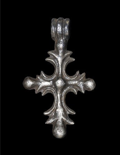 Byzantine Silver Bifacial Cross Pendant: 12th century AD. A cast pendant comprising an ornate cross with foliate arms and bulb finials, with a central boss; above the upper bulb a three-ribbed suspension loop. Silver, 15.06 grams, 52 mm. Fro