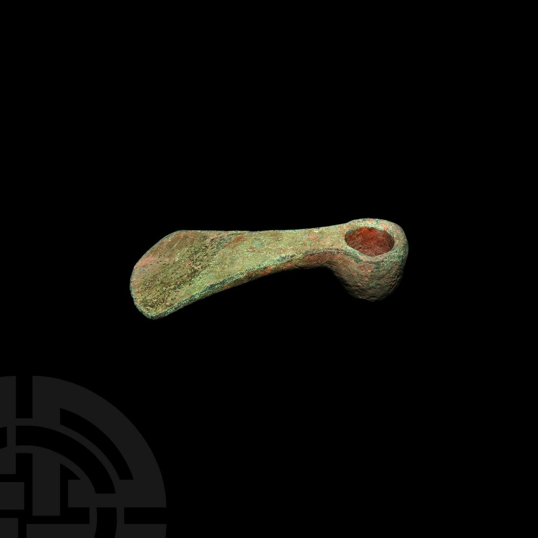 Iron Age Socketted Adze: 1st millennium BC. A bronze hand adze with short tubular socket and D-section cutting edge perpendicular to the socket. See similar types in Flinders Petrie, W., Tools and Weapons, British School of A