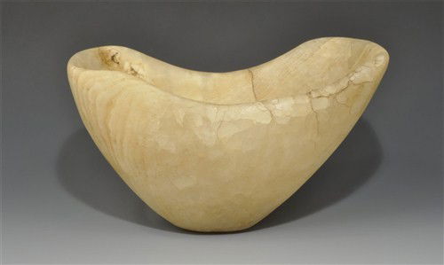 Near Eastern - Bactrian Alabaster Vessel: Circa late 3rd-early 2nd millennium BC. A hollow alabaster vessel, D-shaped in profile with convex ends; the underside narrow and flattened, the rim recessed on the longer sides. Alabaster, 1.98 Kg, 2