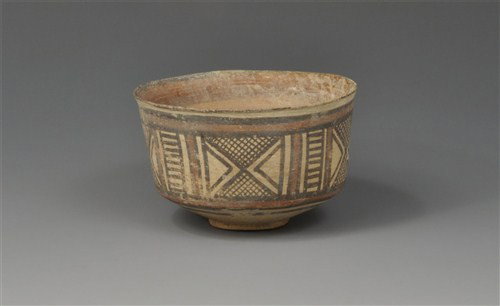 Indus Valley - Chanhudaro Geometric Pot: Circa 2600–1900 BC. A delicate ceramic pot with slightly expanding body and shallow base; finely decorated in panels with geometric motifs; concentric banding to the base and interior. Ceramic, 65 g