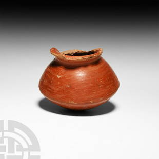 Egyptian Burnished Terracotta Jar: New Kingdom, 1550-1070 B.C. A burnished red slip jar with carinated body, everted rim and rounded base. 290 grams, 10.8 cm wide (4 1/4 in.) From an old English collection, by descent. Property of an