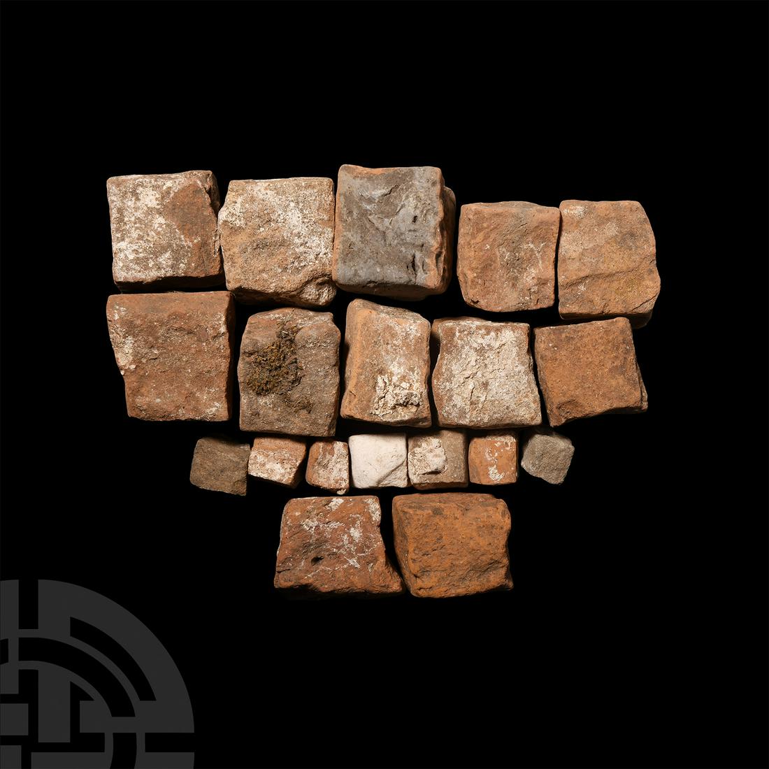 Roman Tesserae Collection: 1st-3rd century A.D. A group of nineteen tesserae classified into two groups: a group of two with an identification label reading 'Roman England. Two red earthenware tesserae cubes from the floor of a