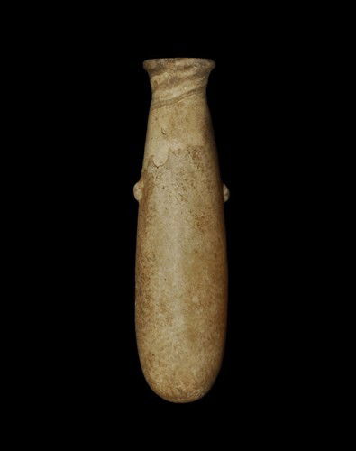 Egyptian Alabaster Albastron: Circa 1550-1070 BC, New Kingdom. A carved alabaster vessel with rounded base, splayed neck, everted rim and two low bulbs to the sides. Alabaster, 90 grams, 11 cm. UK art market, acquired prior to 200