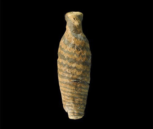 Egyptian Old Kingdom Wooden Vessel: Circa 3rd millennium BC, Old Kingdom. A carved wooden bottle with tapering body and narrow neck, painted with three helical lines in black on tan surface. Wood, 10 grams, 77 mm. UK private collection,