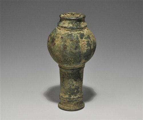 Near Eastern Bronze Luristan Ceremonial Mace Head: Circa 1,250-650 BC. A cast tube with everted rim at the lower end; narrow ribbed collars at both ends, expanding to a thick ridged bulb. Bronze, 355 grams, 10 cm. From an old English collection.
