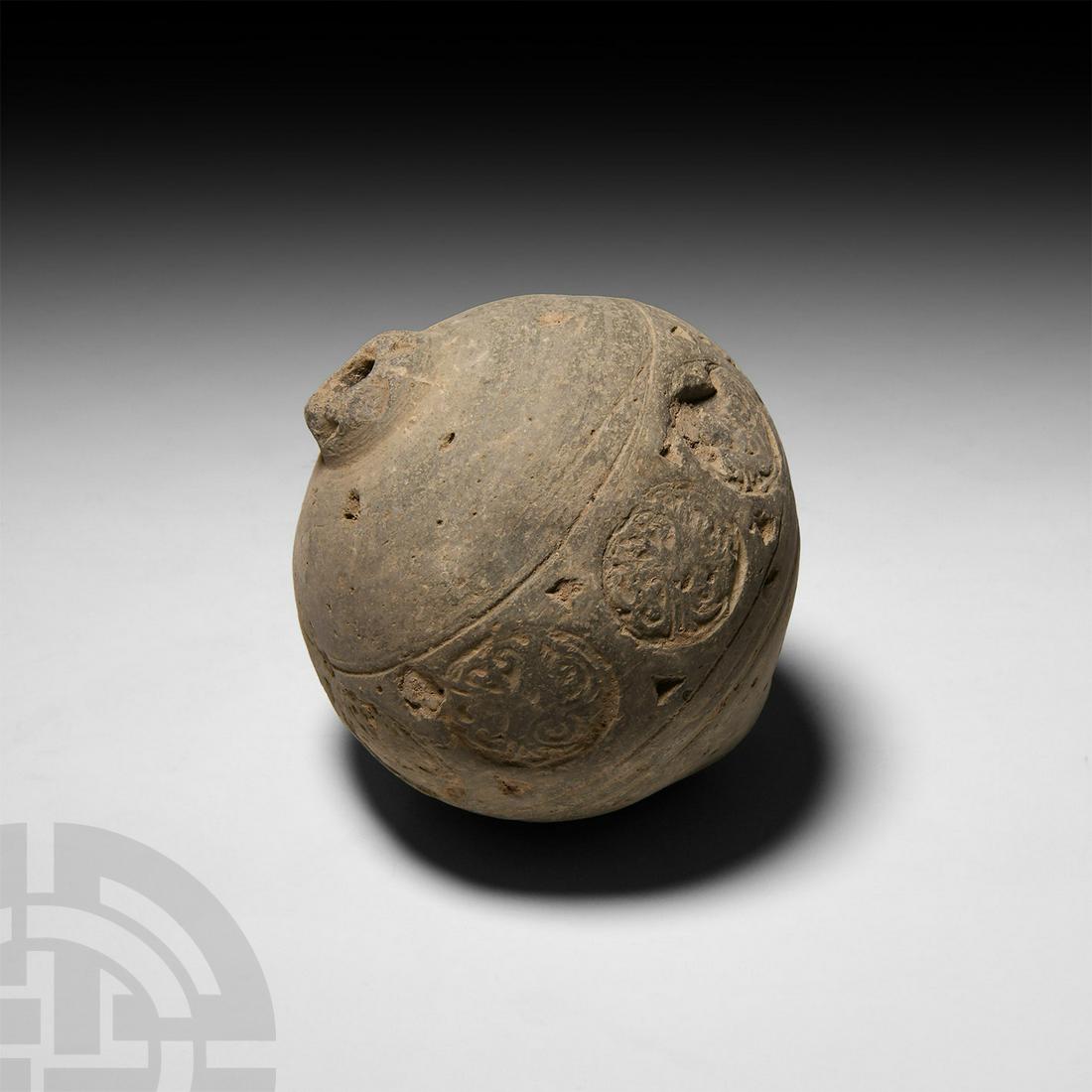 Byzantine 'Greek Fire’ Fire Bomb or Hand Grenade: 9th-11th century A.D. A bulbous ceramic vessel, stamped with a medial frieze of ornate roundels, intended to be filled with explosive liquid and wick and used as a hand grenade. Cf. Arendt, W. I., Gra