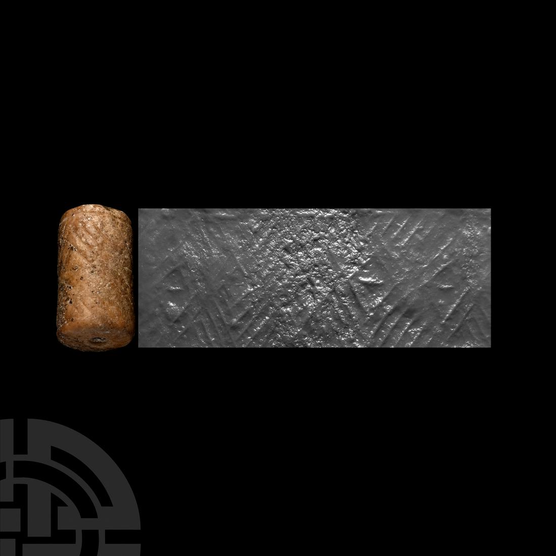 Jemdet Nasr Cylinder Seal: 3rd millennium B.C. An alabaster cylinder seal with incuse design composed of lozenges and chevrons with inscribed borders; pierced for suspension; accompanied by a museum-quality impression. Cf. Teis