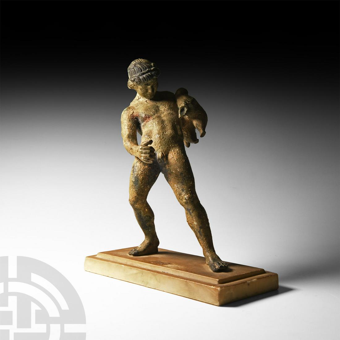 Statuette of A Satyr: Circa 19th century A.D. A copper-alloy statue of a satyr pouring wine from a wine skin, his right hand positioned to catch the liquid in a goblet (absent), modelled in the round standing nude in a dru