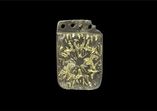 Anglo-Saxon Silver Gilt Winchester Style Strapend: Circa late 10th-11th century AD. A cast silver strap-end with decorative panel bearing Winchester Style foliate decoration, the thick (6mm) surface gilded; the attachment plate pierced with five holes