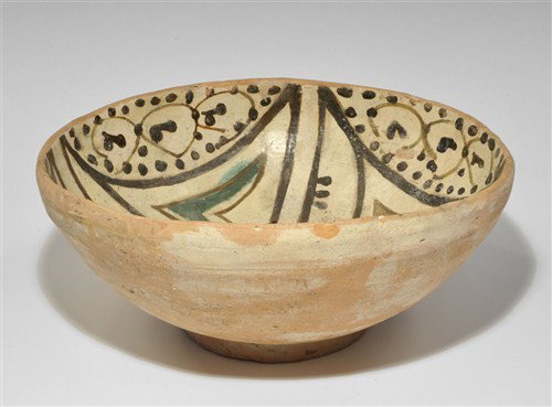 Islamic Ceramic Glazed Bowl: An undated ceramic bowl with glazed interior, geometric and foliage design in brown, green and yellow. Ceramic, 1.2 kg, 25 cm. Property of a London Gentleman; acquired before 1975.