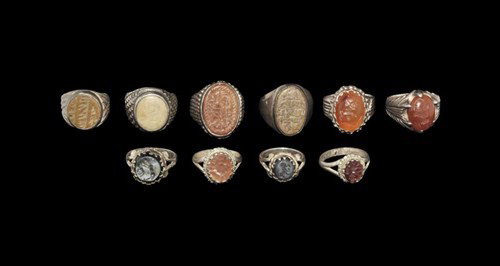Near Eastern Sassanian Gemstones Set in Bedouin Rings G: Circa 2nd-7th century AD. A mixed group of Sassanian intaglio gemstones set in 19th/20th century Bedouin finger rings. Silver and stone, 90 grams, 22-29 mm. UK art market, acquired prior to 1985. [10,