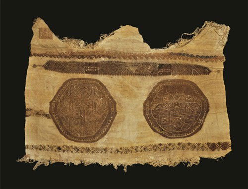 Egyptian Large Coptic Textile Fragment: Circa 6th-9th century AD A large textile fragment in wool with embroidered round geometric panel and foliate border in red-brown. Textile, 165 grams, 69 cm (27 1/4") Property of a London Gentleman; ac